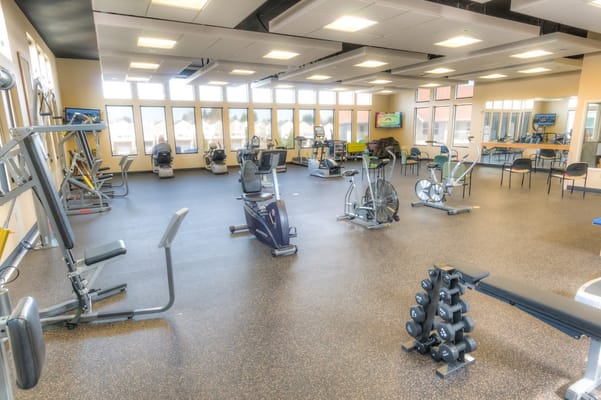 Well-equipped fitness room with exercise machines