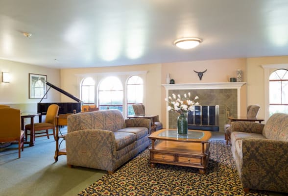 Cozy common area with seating and a piano