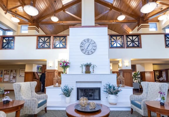 A cozy common area with seating and a fireplace