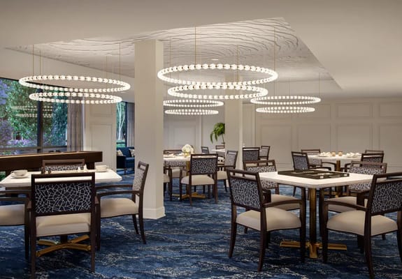 Elegant dining area with modern lighting and furniture