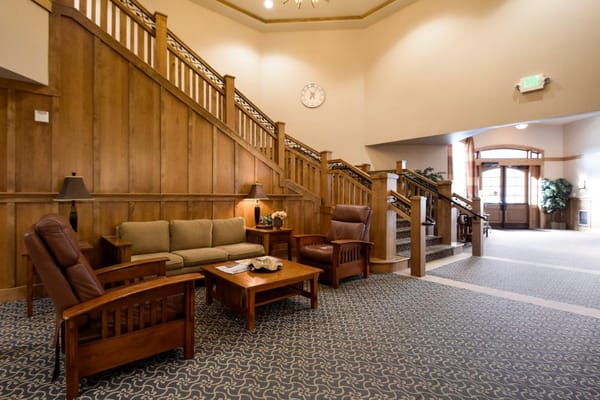 Welcoming common area with seating and staircase