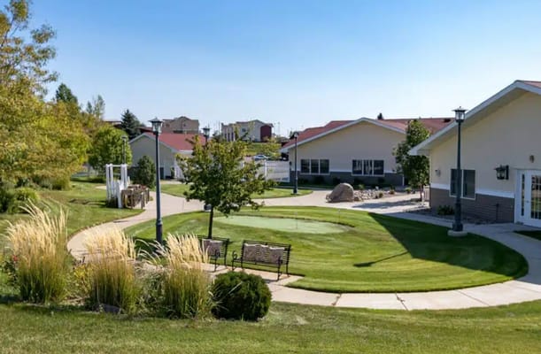 Lush garden area with walking paths and benches