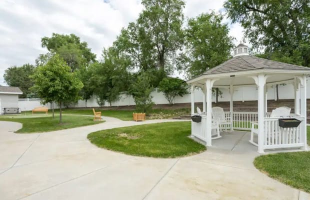 Outdoor garden area with gazebo and pathways