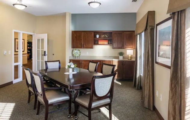 Bright activity room with a dining table and chairs