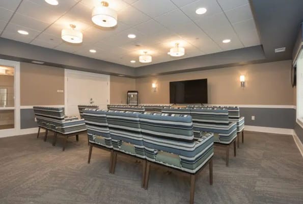 Seating area with striped chairs in a common room