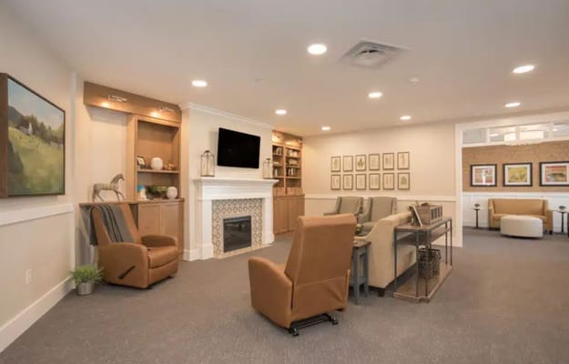 Inviting living room with seating and a fireplace