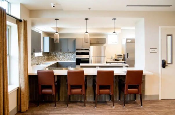 Bright interior kitchen area with seating