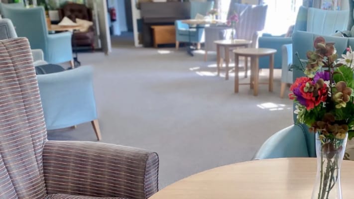 Cozy common area with furniture and floral decoration