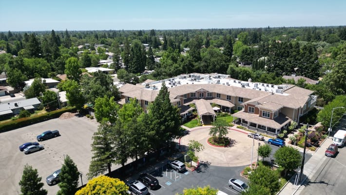 Aerial view of Sunrise of Carmichael senior living facility surrounded by greenery.