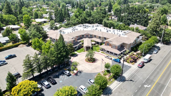 Aerial view of Sunrise of Carmichael, showcasing the building and surrounding greenery.