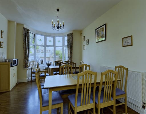 Dining room with wooden tables and chairs
