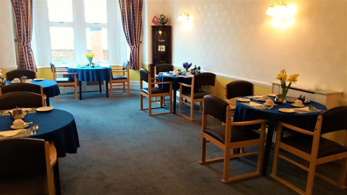 Dining area with tables set for a meal