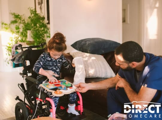 Care staff assisting a child with a puzzle in a cozy setting