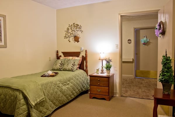 Cozy resident room with a bed and decorative elements