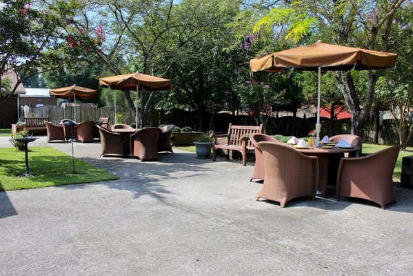 Outdoor patio area with shaded seating