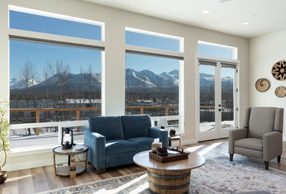 Bright common area with large windows and mountain view