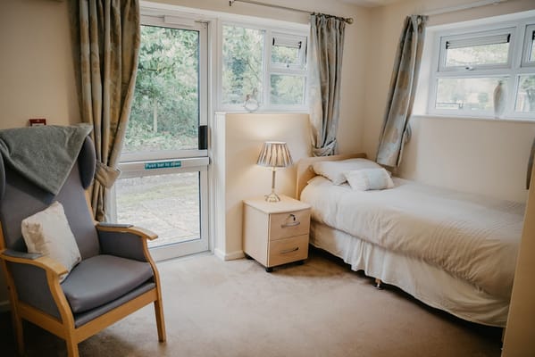 Cozy resident room with bed and seating area