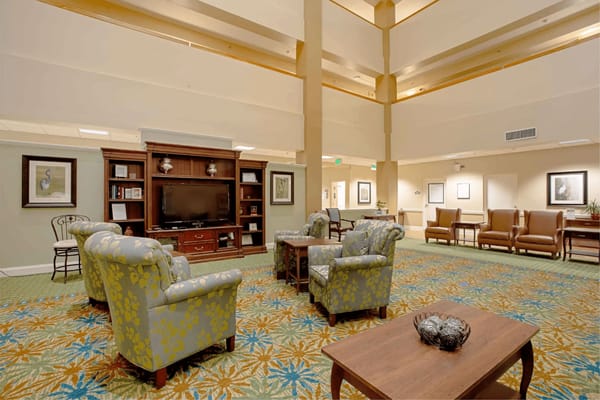 Bright common area with seating and television