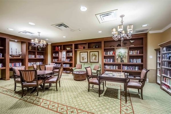 Cozy library with bookshelves and seating areas