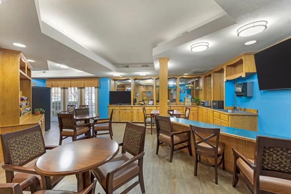 Bright common area with seating in a senior living facility