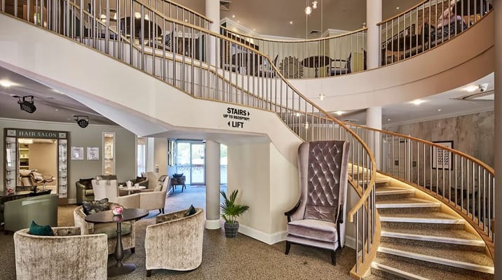 Interior view of a stylish common area with stairs
