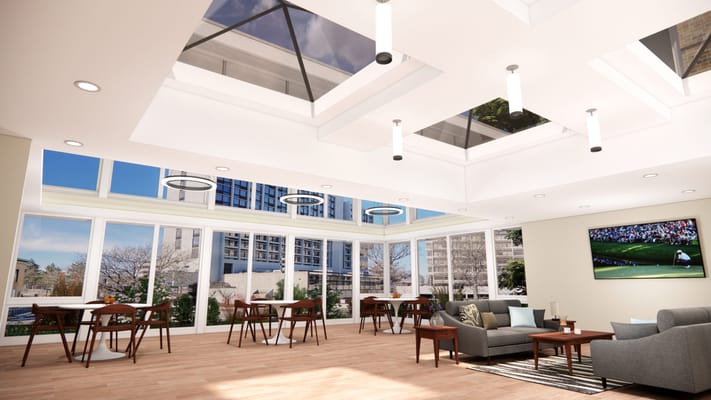 Bright lounge area with large windows and modern furniture