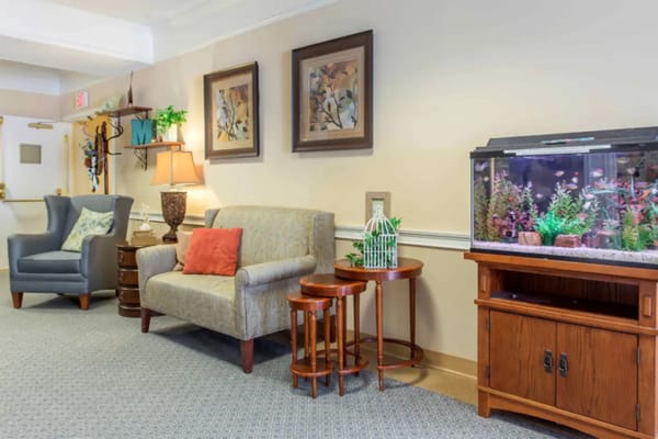 Cozy common area with seating and an aquarium
