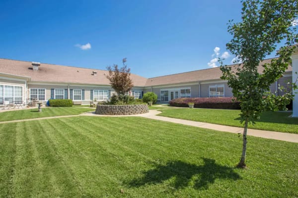 Outdoor courtyard area with greenery and seating