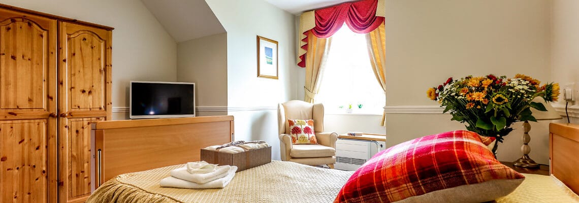 Cozy interior of a resident room with flowers and decor
