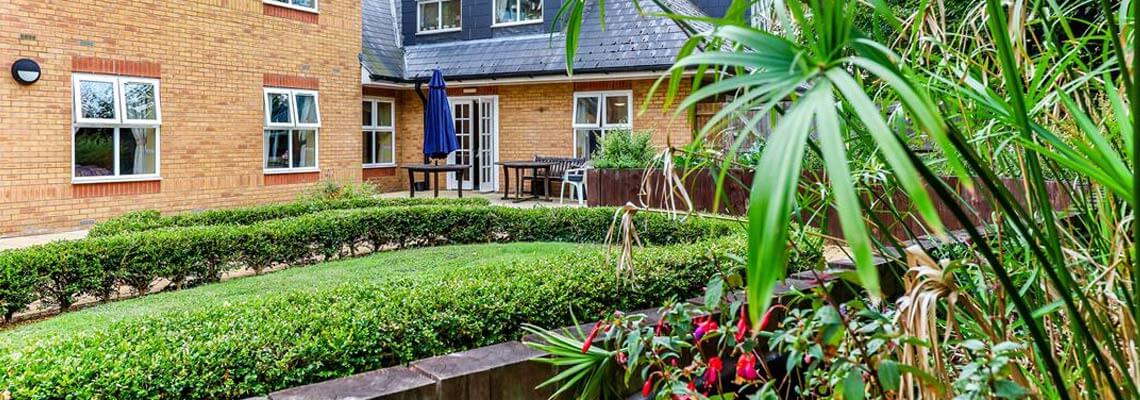 A well-maintained outdoor garden area with seating
