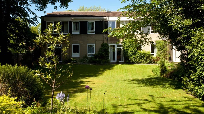 Exterior view of the facility surrounded by green space