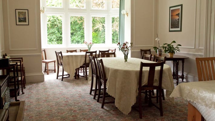Dining area with tables and floral decorations