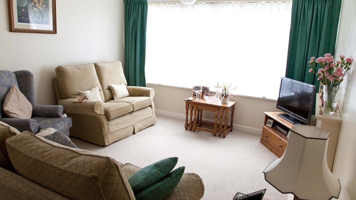 Cozy common area with seating and window view