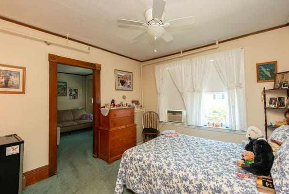 Cozy private resident room with floral bedding and decor