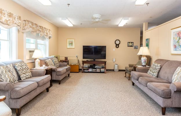 Cozy common area with seating and TV