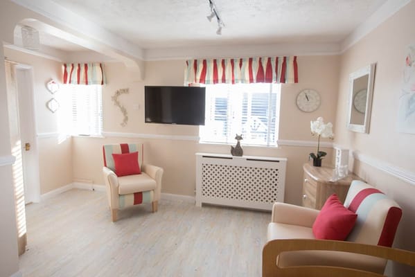 Brightly lit common area with comfortable seating