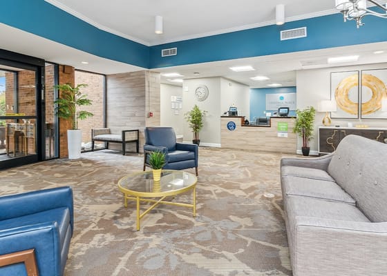 Inviting lobby with seating and reception area at Heritage Place Senior Living.