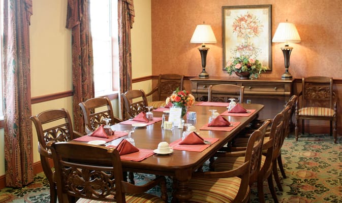 Dining room set for a meal in a cozy setting