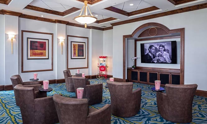 Common area with seating and a large screen