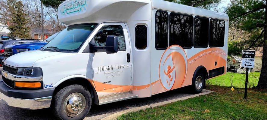 Facility shuttle bus parked at Hillside Terrace