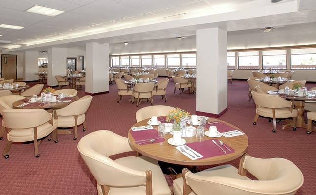 Bright dining room set for meals with elegant table settings