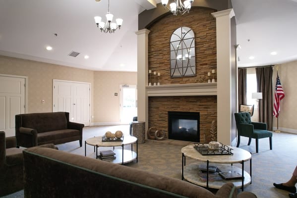 Brightly lit common area with seating and decor