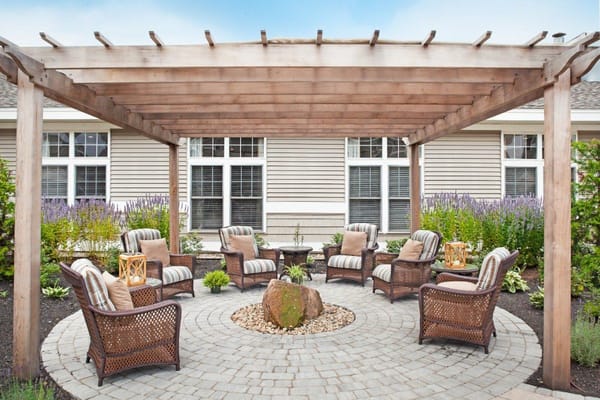 Outdoor seating area with comfortable chairs and landscaping