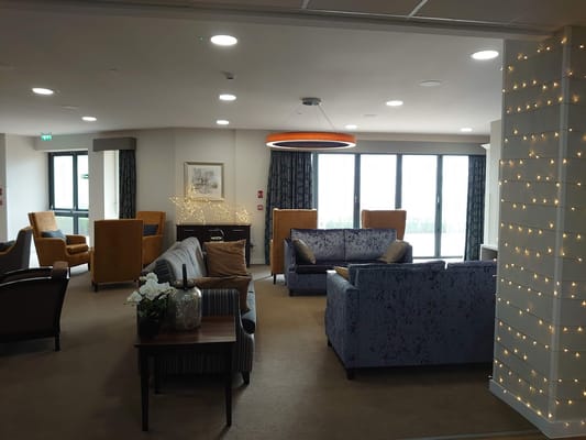 Interior common area with seating and decorative lights