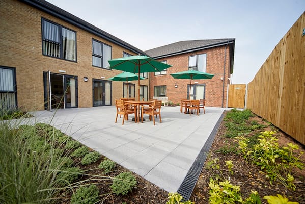 Outdoor patio area with tables and umbrellas