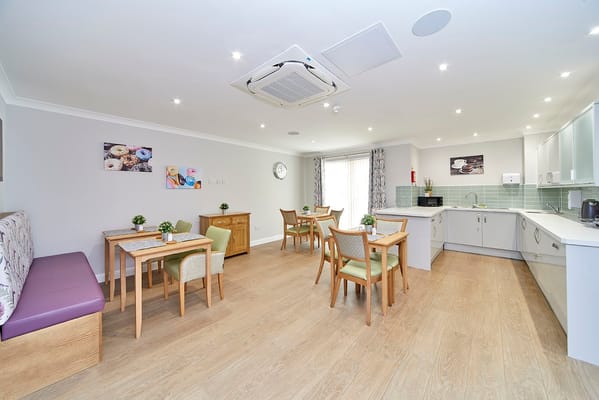 Bright dining room area with tables and chairs