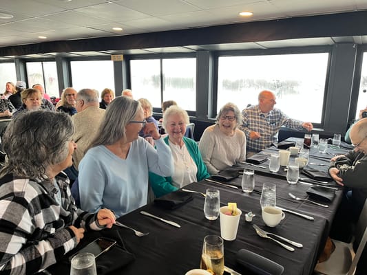 Residents enjoying a meal together in a dining area