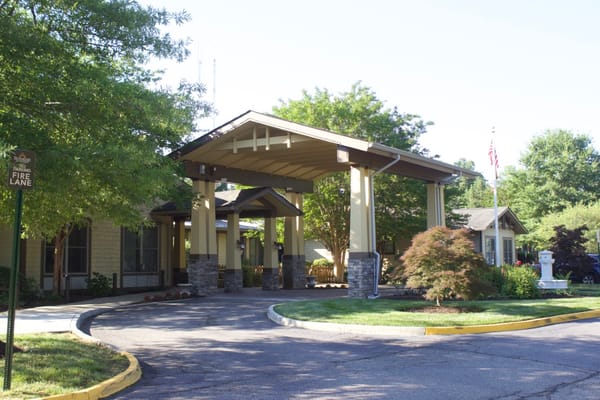 View of the entrance to Sunrise at Bon Air senior living facility
