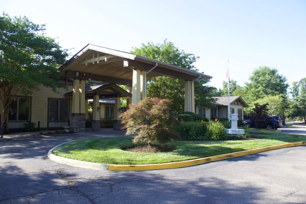 Entrance view of Sunrise at Bon Air senior living facility.