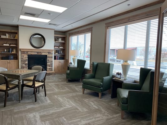 Interior common area with seating and bookshelves